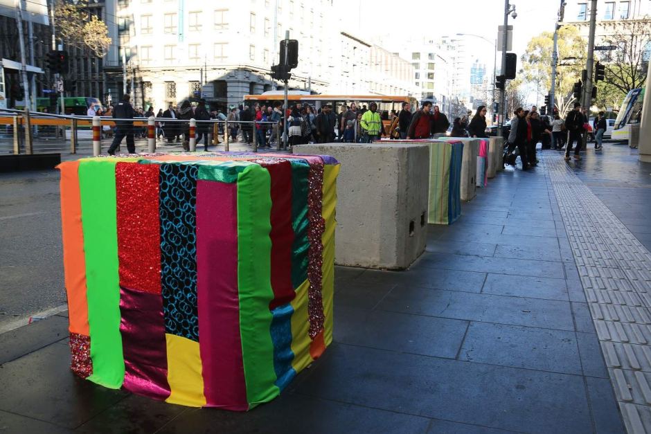 Colourfully decorated bollard at Southern Cross Station melbourne